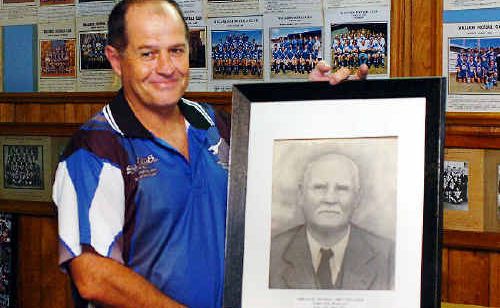 HISTORICAL RECORD: Wallaroos committee member Noel Glazier with a portrait of Abe Thacker, the father of the Maryborough Wallaroos. The club formed in 1893. HISTORICAL RECORD: Wallaroos committee member Noel Glazier with a portrait of Abe Thacker, the father of the Maryborough Wallaroos. The club formed in 1893.